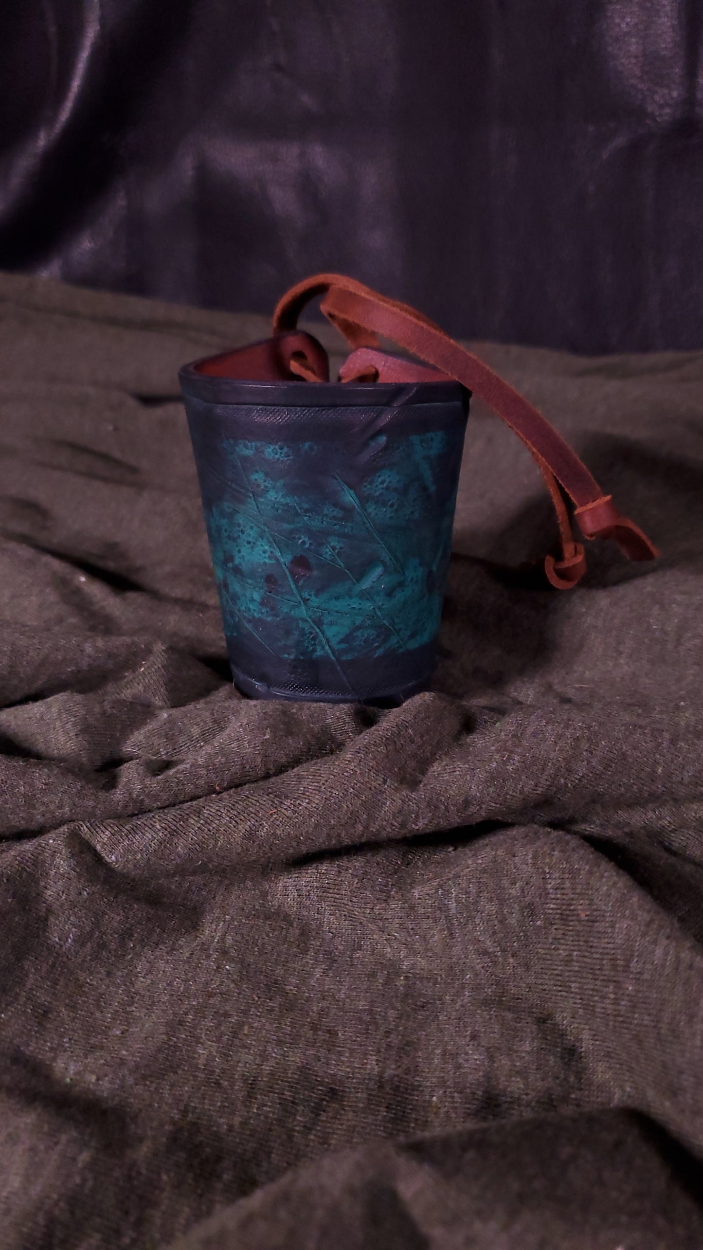 Green small cuff with laces and battle damage