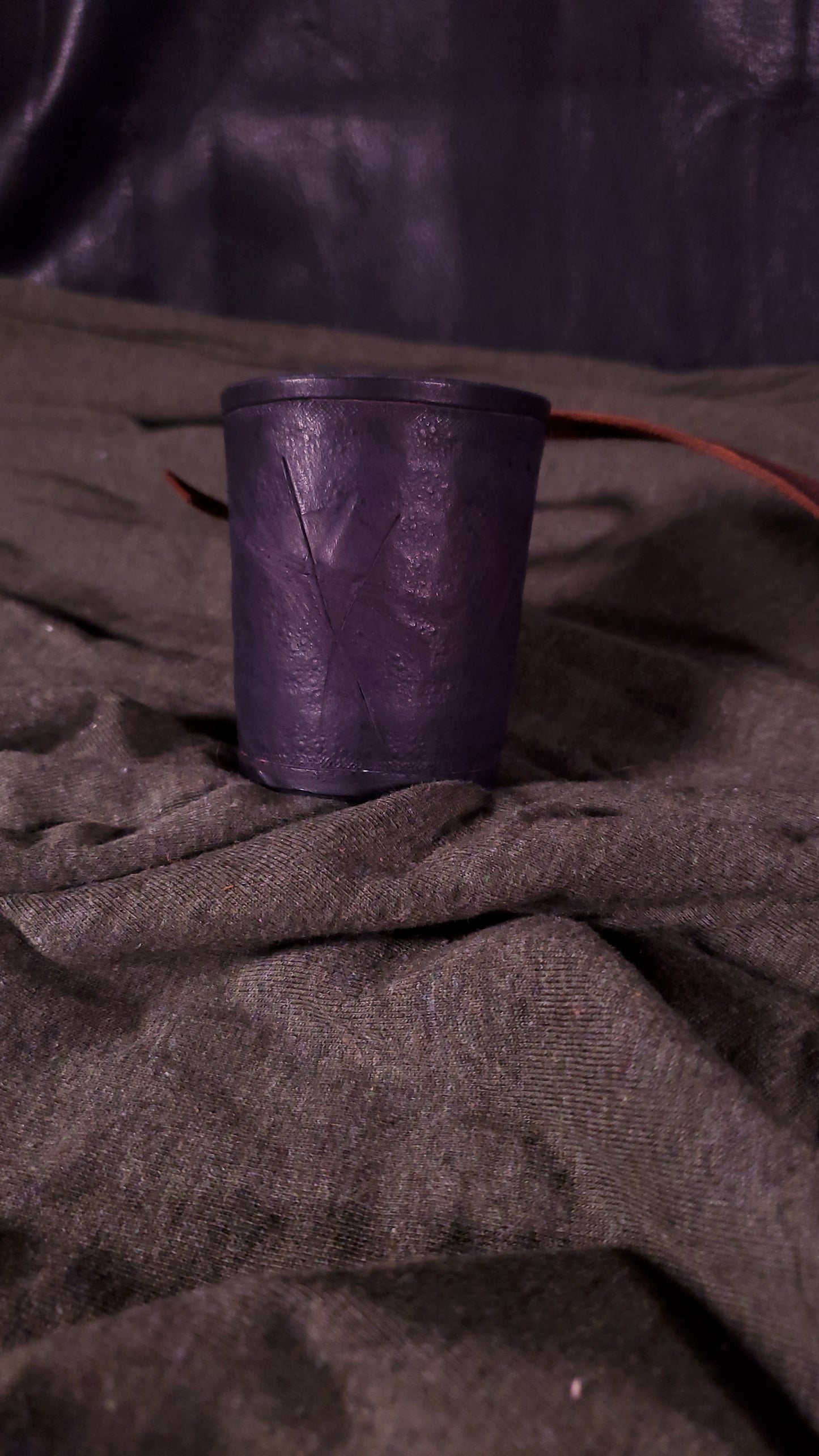Black small cuff with laces and battle damage