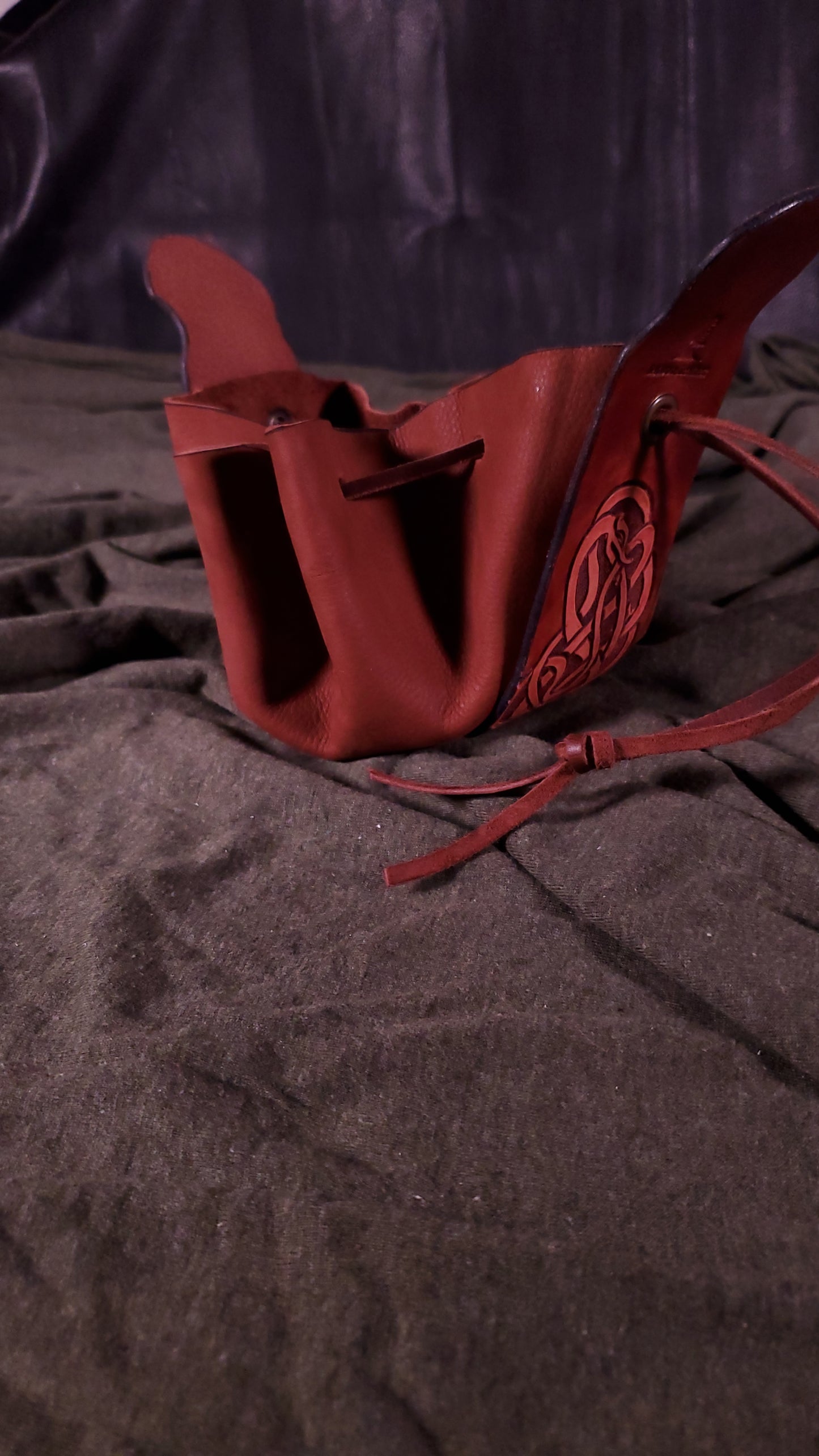 tooled serpent dice bag in a mahogany color open