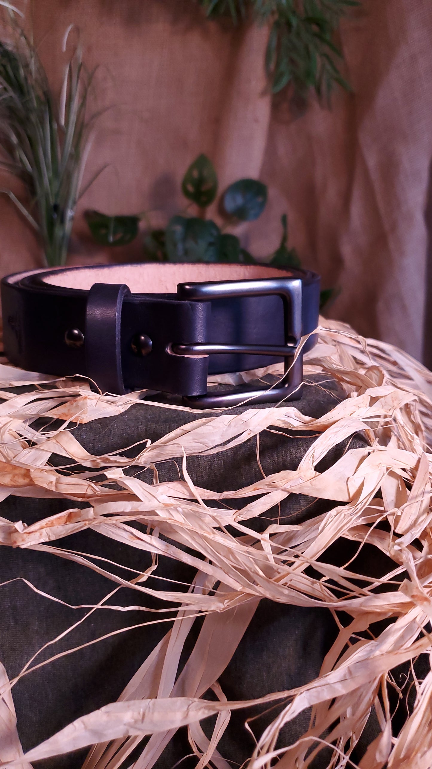 Black belt with a gun metal buckle and matching hardware.
