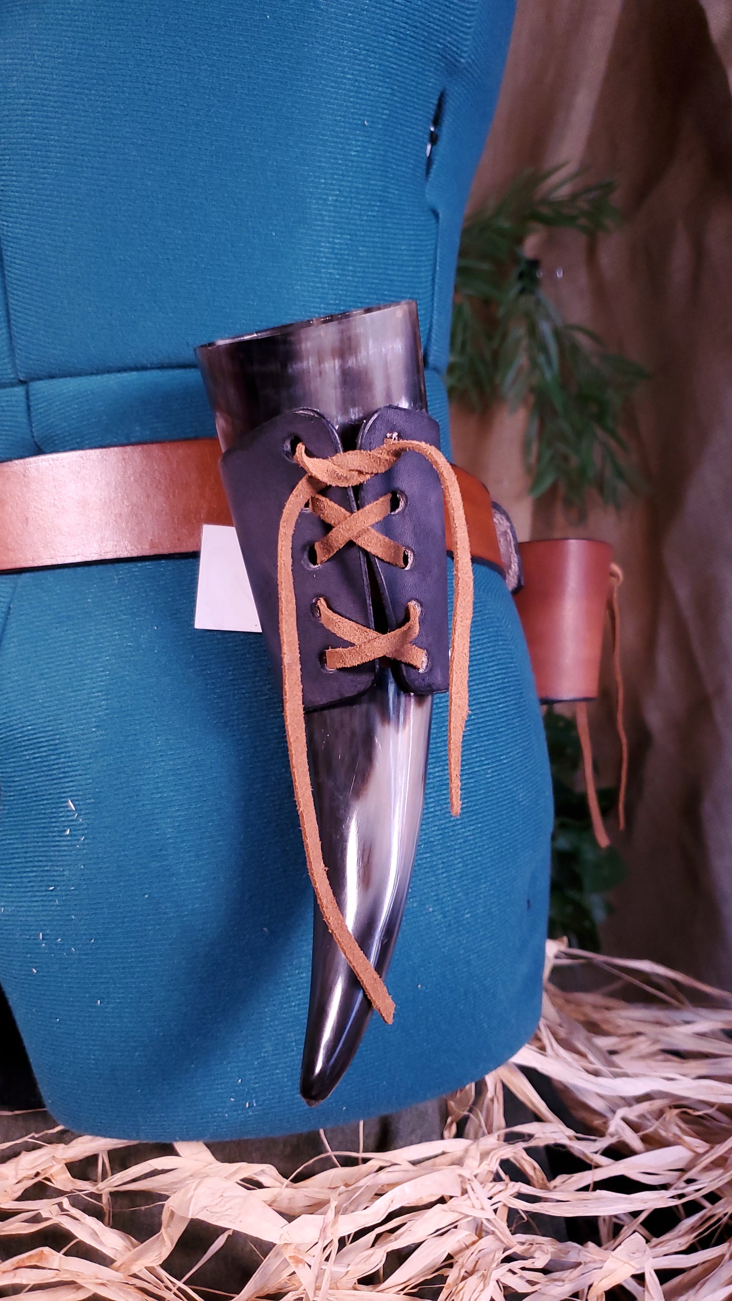 Drinking horn Holder in a black color with a light brown lace