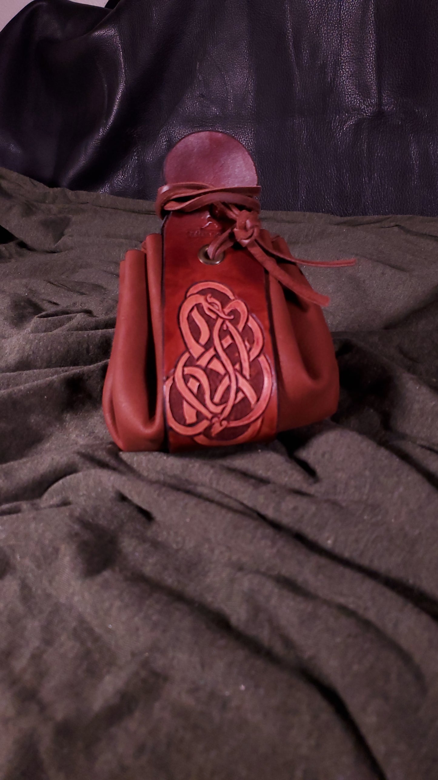 Tooled serpent Dice bag in a mahogany color closed