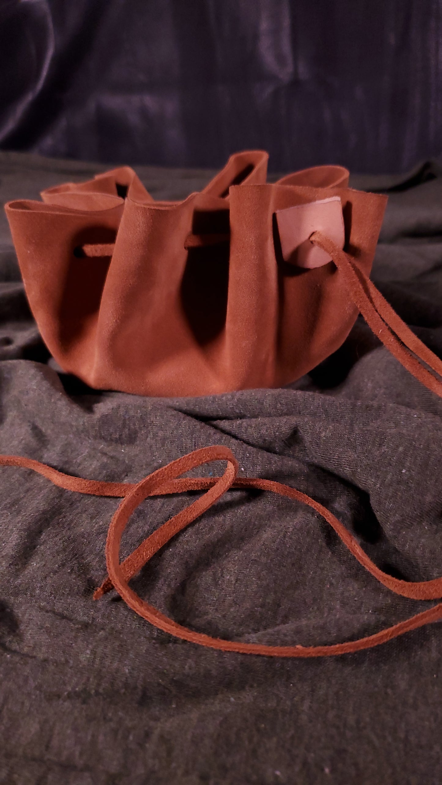 open suede dice bag in a light brown color