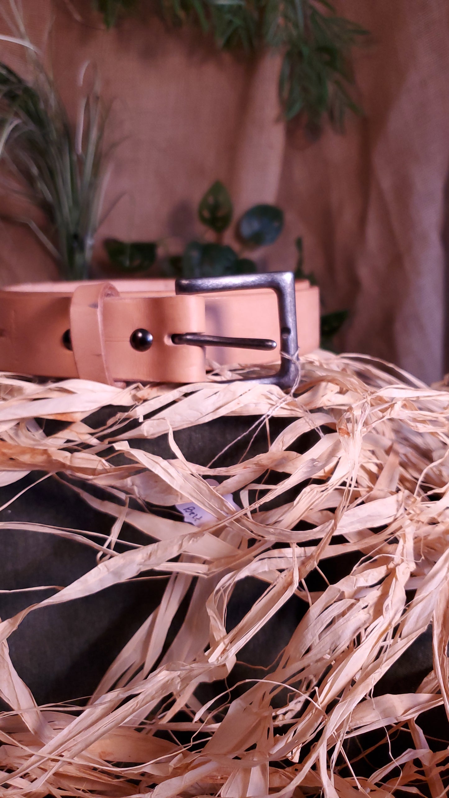 Natural colored belt with an antique nickel buckle and matching hardware.