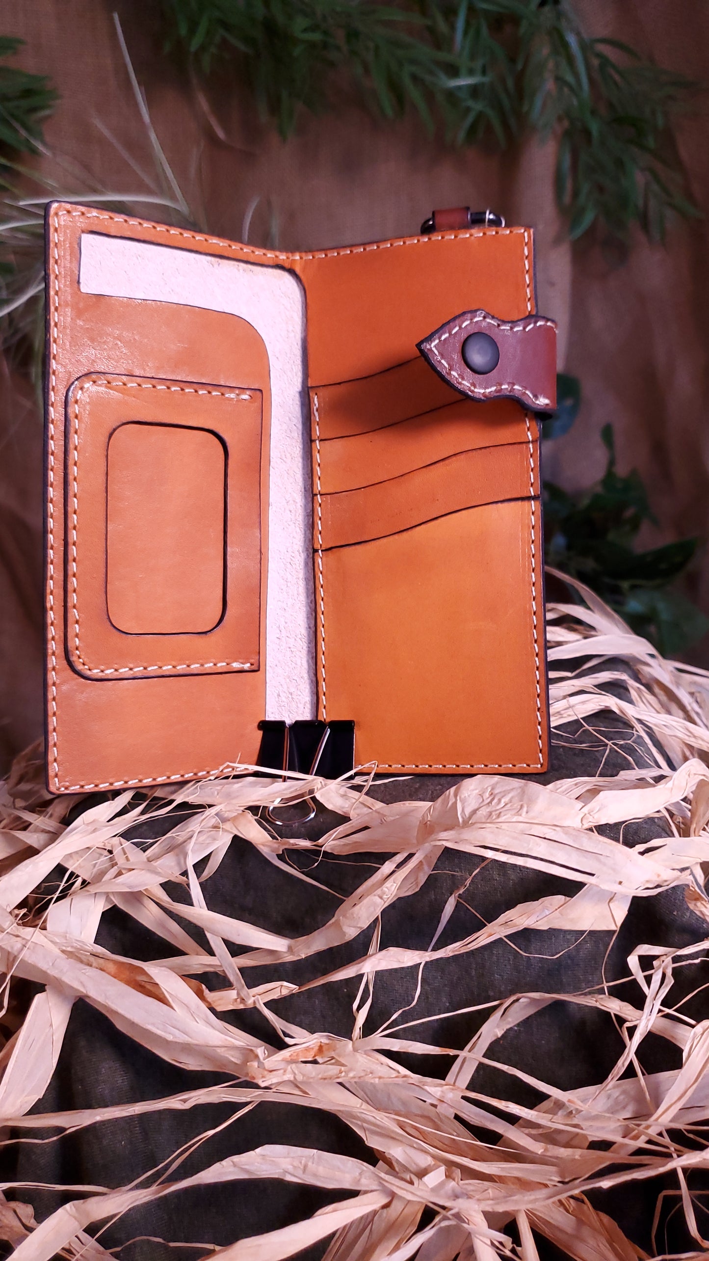 Interior of the Biker Wallet, featuring an ID pocket with window and a cash slot on the left side, and 4 card slots on the right side